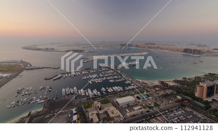 Aerial view from Dubai Marina panorama from day to night transition timelapse Aerial view from Dubai Marina panorama from day to night transition timelapse 112941128