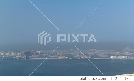 View on artificial island Palm Jumeirah in Dubai, UAE timelapse 112941181