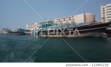 Excursion on traditional Abra boat at the creek in Dubai, UAE timelapse Excursion on traditional Abra boat at the creek in Dubai, UAE timelapse 112941210