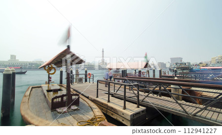 Boat station timelapse along Deira's shore of Dubai Creek, UAE. 112941227