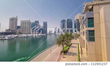 Dubai Marina skyscrapers. View from embankment timelapse hyperlapse Dubai Marina skyscrapers. View from embankment timelapse hyperlapse 112941237