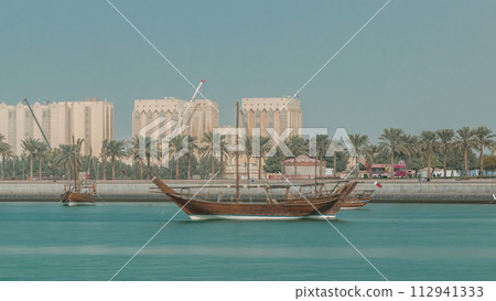 Dhows moored off Museum Park timelapse in central Doha 112941333