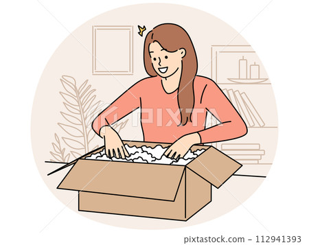 Smiling woman unpack box with order 112941393
