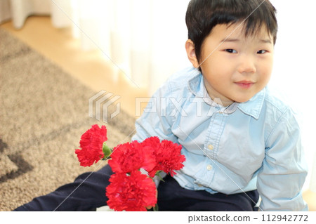 A boy with carnation 112942772