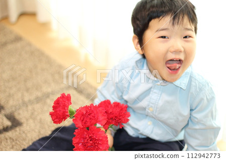 A boy with carnation 112942773