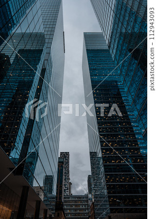 tall skyscrapers buildings looking up perspective, modern architecture of steel and glass, skyline of big city 112943093