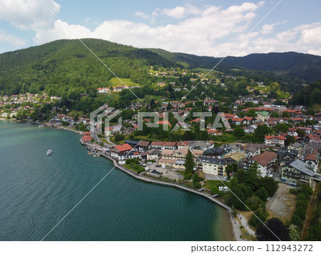 view with mountains, a blue sky in the clouds, of a lake in Bavaria,Germany view with mountains, a blue sky in the clouds, of a lake in Bavaria,Germany 112943272