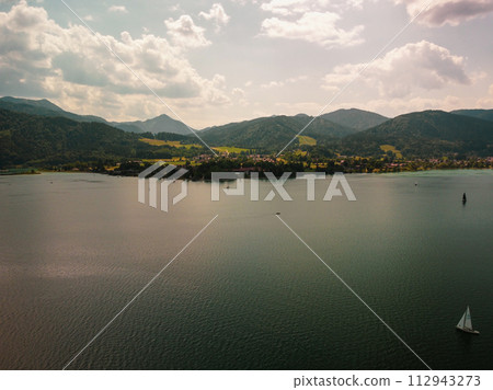 Panoramic view of deep blue Lake Lugano in Switzerland surrounded by mountains Panoramic view of deep blue Lake Lugano in Switzerland surrounded by mountains 112943273