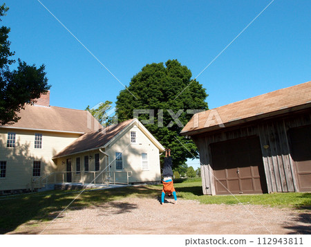 Man wearing a hat, long sleeve t-shirt, pants, and slippers Handstands at Historic Jonathan Trumbull jr. House Museum Man wearing a hat, long sleeve t-shirt, pants, and slippers Handstands at Historic Jonathan Trumbull jr. House Museum 112943811