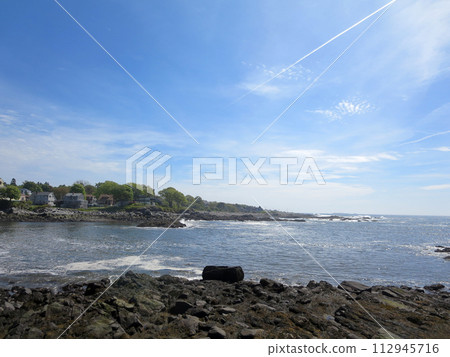 Ryefield Cove with homes along shoreline on Peak Island 112945716