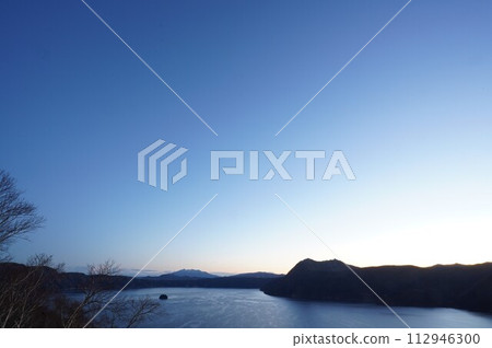 Lake Mashu and Mt. Mashu before dawn in early winter 112946300
