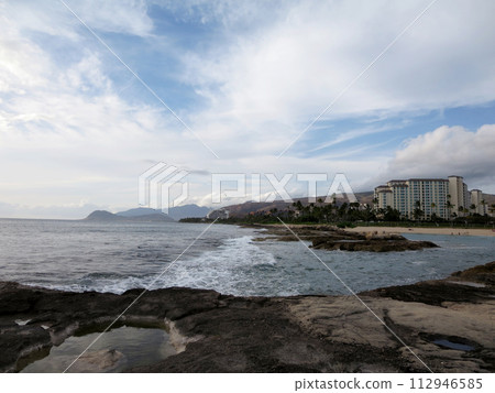 Rocky shoreline next to lagoon at Ko Olina Rocky shoreline next to lagoon at Ko Olina 112946585