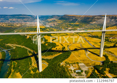 Cable-stayed Millau Viaduct spanning Tarn River valley, France 112946797