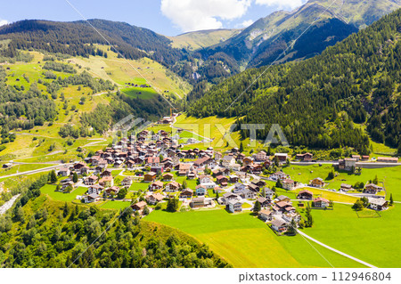 View from a height of the Curaglia village in the valley medel View from a height of the Curaglia village in the valley medel 112946804
