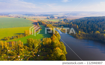 Autumn landscape with lake 112946907
