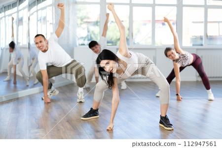 Group of young people dancing hip hop Group of young people dancing hip hop 112947561
