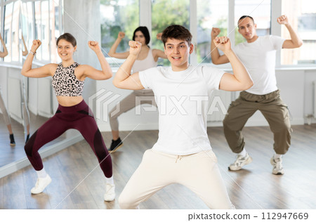 Group of young people dancing jazz funk Group of young people dancing jazz funk 112947669