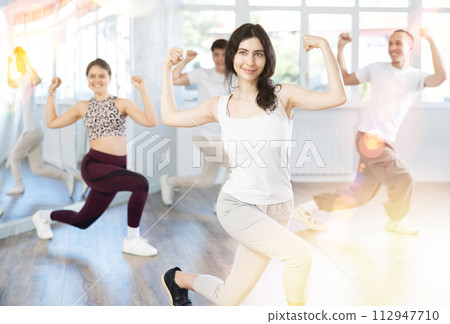 Team of dancers performing swing dance in ball studio 112947710