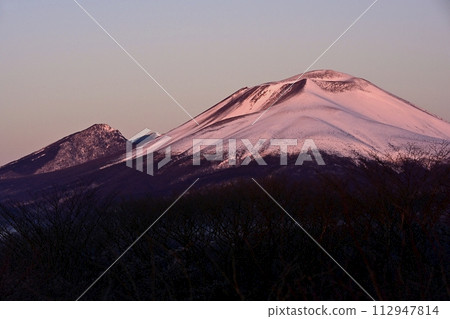 The lingering moon over Mt. Asama at sunrise from the Karuizawa Old Usui Pass viewing platform The lingering moon over Mt. Asama at sunrise from the Karuizawa Old Usui Pass viewing platform 112947814