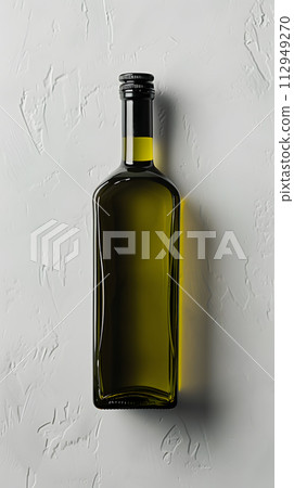 AI-generated content. A glass bottle of olive oil with a bottle stopper is placed on a white tableware surface. The cylindershaped bottle contains liquid solvent 112949270