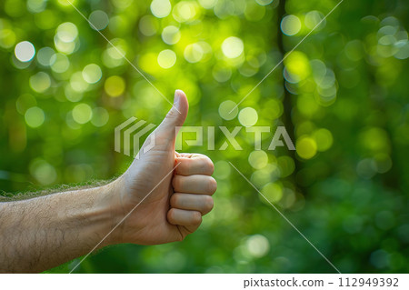 AI-generated content. Thumbs up gesture on a bokeh greenery background 112949392