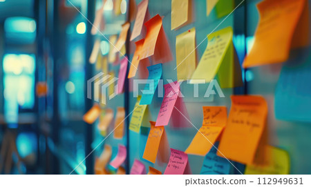 Many different colorful sticky notes on wall in office. Office work or reminder concepts. 112949631