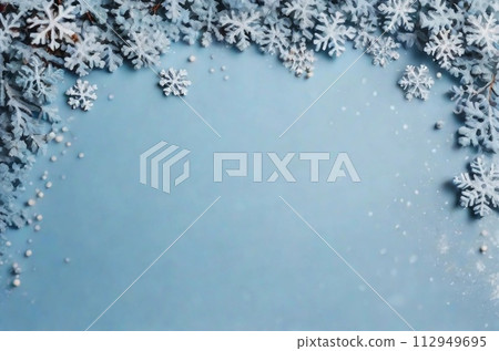 Christmas background with snowflakes on pastel blue texture. Top view, copy space. Winter flatlay. Christmas background with snowflakes on pastel blue texture. Top view, copy space. Winter flatlay. 112949695