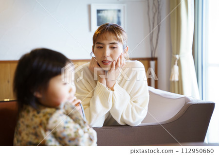 mother taking care of her child 112950660