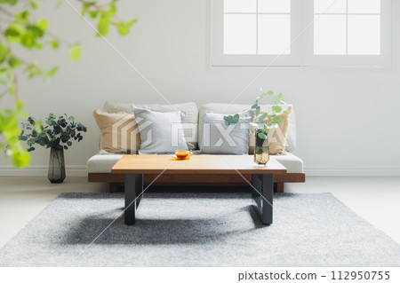 A living room with a sofa A living room with a sofa 112950755