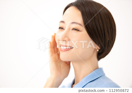 Woman touching her cheek beauty 112950872