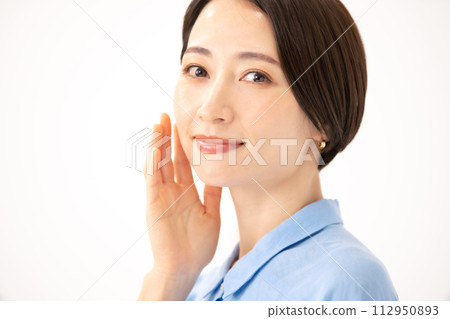 Woman touching her cheek beauty Woman touching her cheek beauty 112950893
