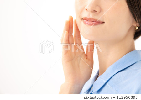 Woman touching her cheek beauty 112950895