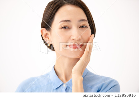 Woman touching her cheek beauty 112950910