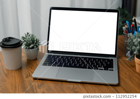Mock up laptop computer white screen on desk. Mock up laptop computer white screen on desk. 112952254