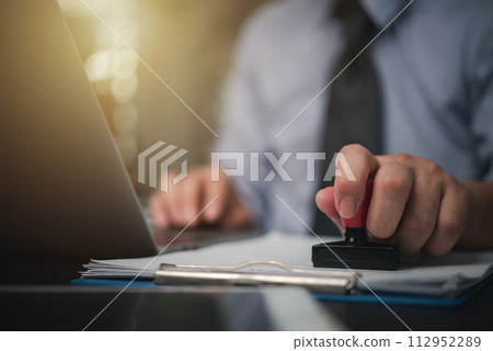 Contract law or paper work business and finance document rubber stamp. For official and legal contracts and agreements, financial statements, investment contracts, real estate documents... 112952289