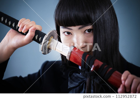 Kill the world and exams! ! Image of a cool high school girl close-up looking at the camera 112952872