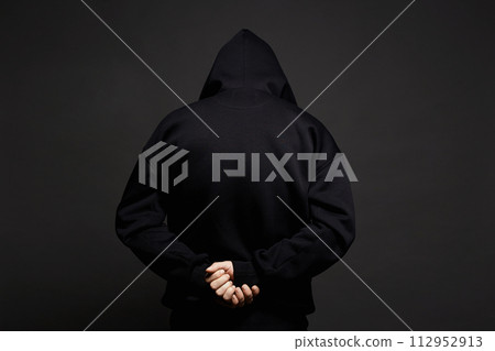 Boy in Black Hood. Back of arrested hooded man Boy in Black Hood. Back of arrested hooded man 112952913