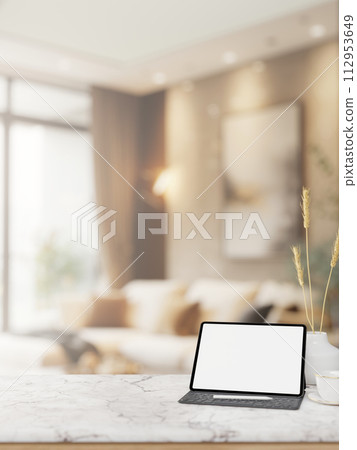 A digital tablet mockup on a luxury white marble tabletop in an elegance contemporary living room. 112953649