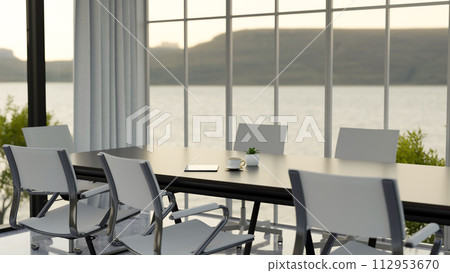The interior design of a contemporary spacious meeting room with a meeting table. The interior design of a contemporary spacious meeting room with a meeting table. 112953670