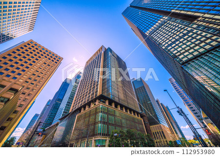 Japan's Tokyo cityscape View of the business district and other areas against the blue sky from the Otemachi Ekimae intersection Japan's Tokyo cityscape View of the business district and other areas against the blue sky from the Otemachi Ekimae intersection 112953980