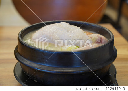 Samgyetang is a traditional Korean soup for health made from chicken Samgyetang is a traditional Korean soup for health made from chicken 112955043