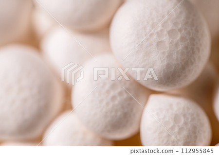 Closeup of a bunch of shimeji mushrooms, with selective focus, macro photography, mushroom natural background 112955845