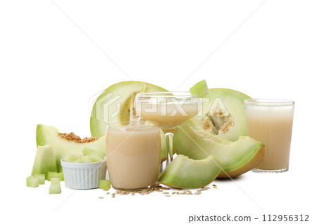 PNG,A slice of fresh melon with a glass of juice, isolated on white background 112956312