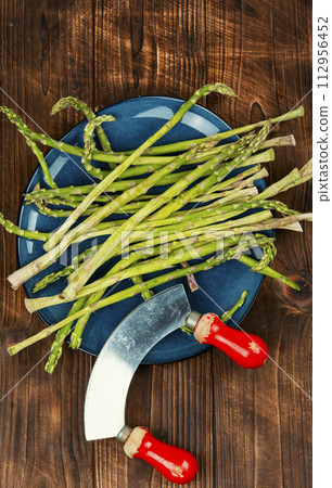 Fresh asparagus on wooden background 112956452