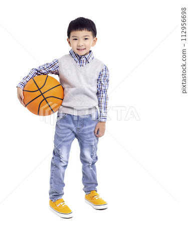 Happy asian Boy  holding a basketball and smiling isolated on white background 112956698