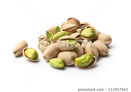 Pistachio nuts with leaves on white backgrounds 112957943