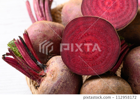 Fresh beetroot in natural basket, Food ingredient 112958172