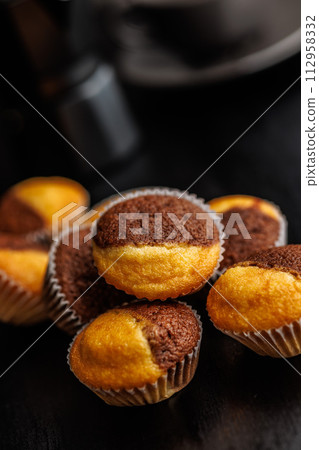 Close Up of a Muffins on black table. Close Up of a Muffins on black table. 112958332