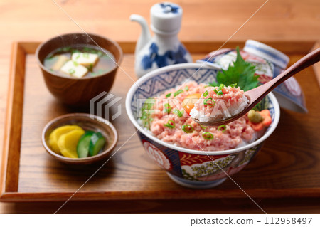 Negitoro-don (tuna tataki-don) on a tray with miso soup and pickles Negitoro-don (tuna tataki-don) on a tray with miso soup and pickles 112958497