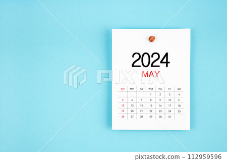 May 2024 calendar page with push pin on blue background. 112959596